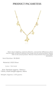 Macro detail of S925 silver 18k gold plated necklace with hollow butterfly charms and pearls