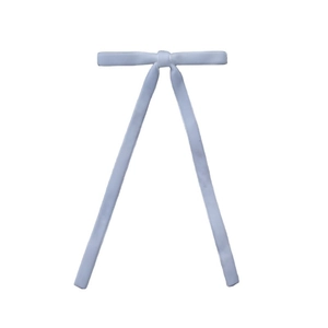 Close-up of a light blue satin long ribbon bow hair clip with a smooth glossy texture