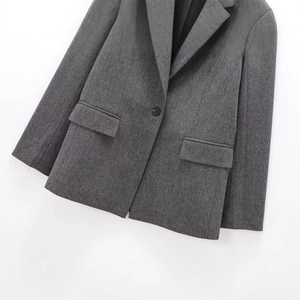 Women's dark grey herringbone blazer with single-button closure and notch lapel
