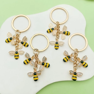 Cute bee keychain with hexagonal honeycomb pendant and gold enamel charms for bags