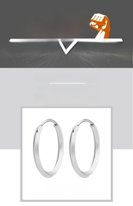 Detailed close-up of polished silver hoop earrings with secure clicker closure and sleek finish