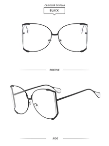 Macro detail of black square frame eyewear with elegant pearl accents on metal temples