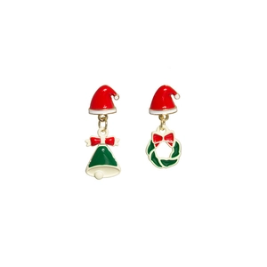 Festive Christmas hat earrings with red bells and green wreaths on white background