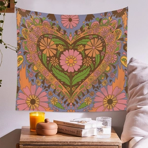 Bohemian floral wall tapestry featuring a large heart-shaped pattern for home decor