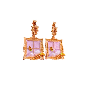 Vintage gold square enamel earrings with pearls and floral motif on white background