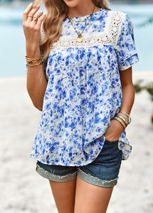 Detail of blue floral print top with white lace trim and hollow out stitching detail