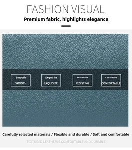Macro view showing the smooth and exquisite lychee grain leather texture of the backpack