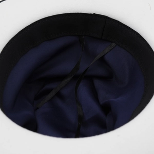 Interior view of white felt fedora featuring dark blue satin lining and adjustable sweatband