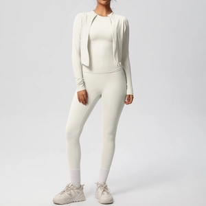 Front view of cream three-piece yoga set with zip-up jacket, vest and high waist leggings