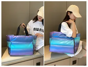 Quilted fitness bag with gradient metallic finish and dry-wet separation detail