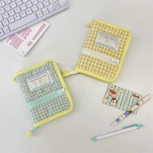 Quilted checkered zip binder notebook cover in yellow and blue fabric with cotton padding