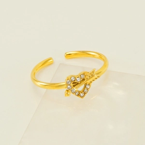 Elegant adjustable gold ring with heart and arrow design featuring sparkling crystals