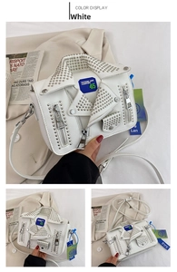 Detail of white PU jacket bag with silver rivets, zippers and touring patch