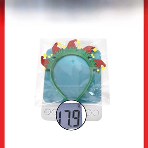 Christmas party headband weight details showing 17.9g on a digital scale for shipping