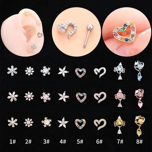 Macro display of diverse heart, star, and snowflake zircon cartilage studs with 1-8 numbering