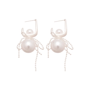 Elegant silver bow earrings with white pearls and delicate metal chain tassels