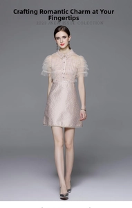 Detail of pink mesh dress with ruffled Peter Pan collar and sequin embroidery texture