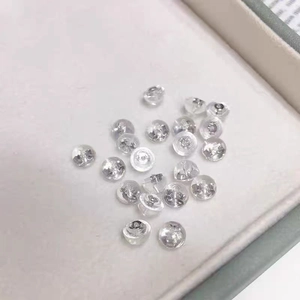 925 silver and silicone earring backings set for jewelry securing on grey background