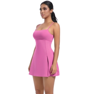 Detailed view of pink sports dress featuring slim straps and a stylish side slit design
