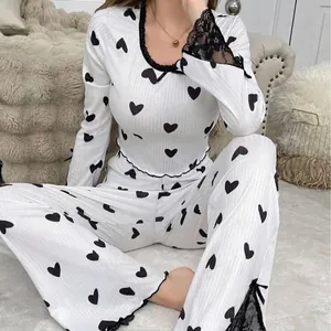 Women's white long sleeve pajama set with black heart print and lace trim details