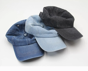 Three shades of denim baseball caps in dark blue, light blue, and washed black colors