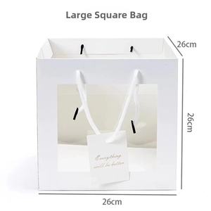 Close-up of white gift bag with transparent window and 26cm dimensions detail