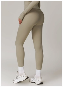 Detail of high-waisted yoga leggings showing breathable fabric and butt-lifting texture
