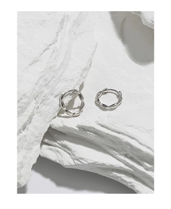 Close-up of S925 sterling silver hoop earrings with a twisted olive bead texture