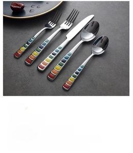 Detailed view of colorful enamel stainless steel cutlery set with mirror finish handles