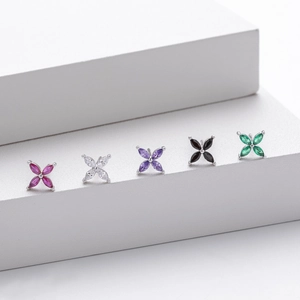 Set of five 925 silver clover earrings with colorful zircon stones on display stand