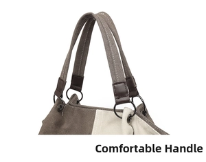 Detail of canvas tote bag showing comfortable handles and circular metal rings