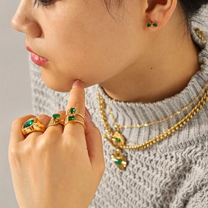 Gold plated stainless steel jewelry set with green zircon stones and heart pendant necklace