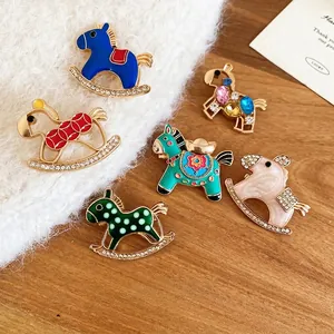 Set of six elegant horse-shaped brooches with enamel finish and sparkling crystals