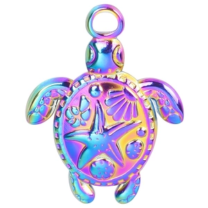 Macro shot of iridescent stainless steel turtle pendant with shell and starfish textures