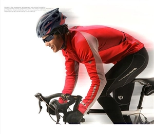 Dynamic action shot of sports cycling sunglasses worn by a cyclist on a road bike