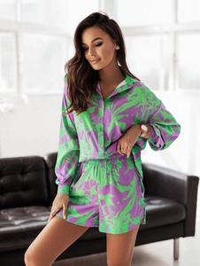 Detail of satin floral shirt and shorts set with purple and green palm leaf prints