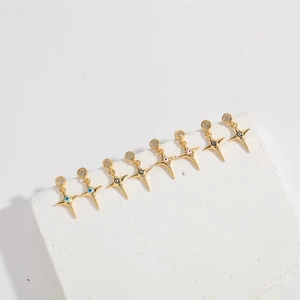 Golden cross star earrings with evil eye motifs and sparkling round stud details