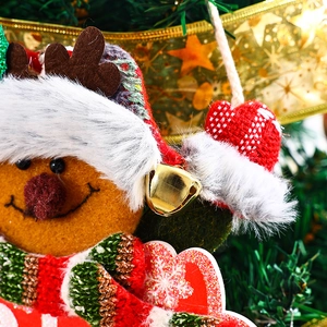 Close-up of reindeer Christmas tree ornament with faux fur collar and metal bell
