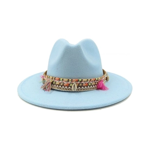 Detail of sky blue felt fedora with woven band, colorful tassels and small shell accents
