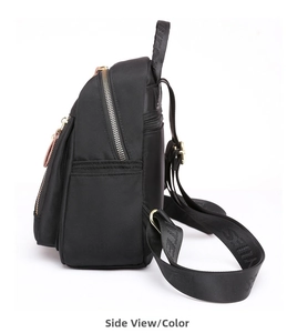 Detailed side view of black nylon backpack featuring golden zippers and jacquard webbing straps