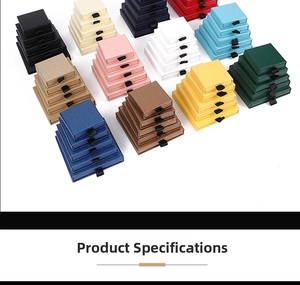 Detailed top view of colorful drawer jewelry boxes in various sizes with silk pull tabs