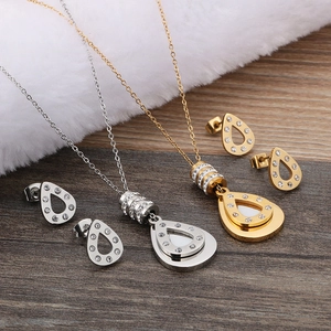 Gold and silver stainless steel teardrop pendant necklace and earring jewelry set with rhinestones