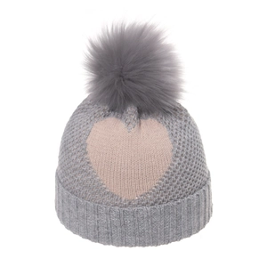 Dark grey knitted beanie for kids with pink heart pattern and a large fluffy pom-pom