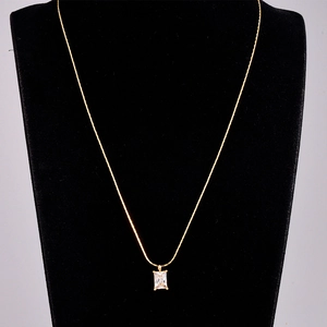 Elegant gold titanium steel necklace featuring a radiant rectangular zircon pendant