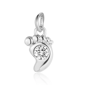 Macro detail of silver footprint charm with zircon inlay for jewelry making