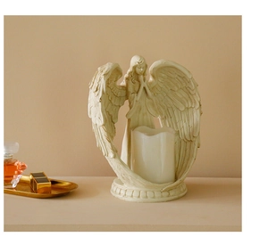 Detailed close-up of a Nordic resin praying angel candle holder with wings for home decor