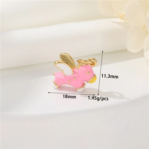 Pink enamel flying horse charm with gold wings and size specs 18mm by 11.3mm