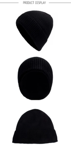 Detail showing the cable knit texture and folded cuff of this warm black winter beanie