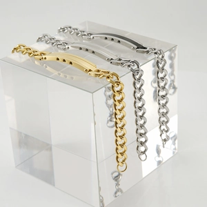 Three-piece tricolor stainless steel heart bracelets in gold and silver finish on display