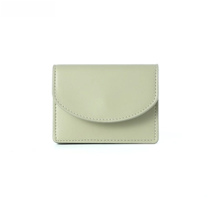 Close-up of a minimalist pale green leather wallet featuring half-round flap and neat stitching